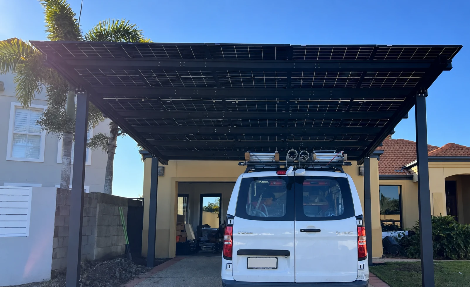 Front view of the solar roof and driveway.