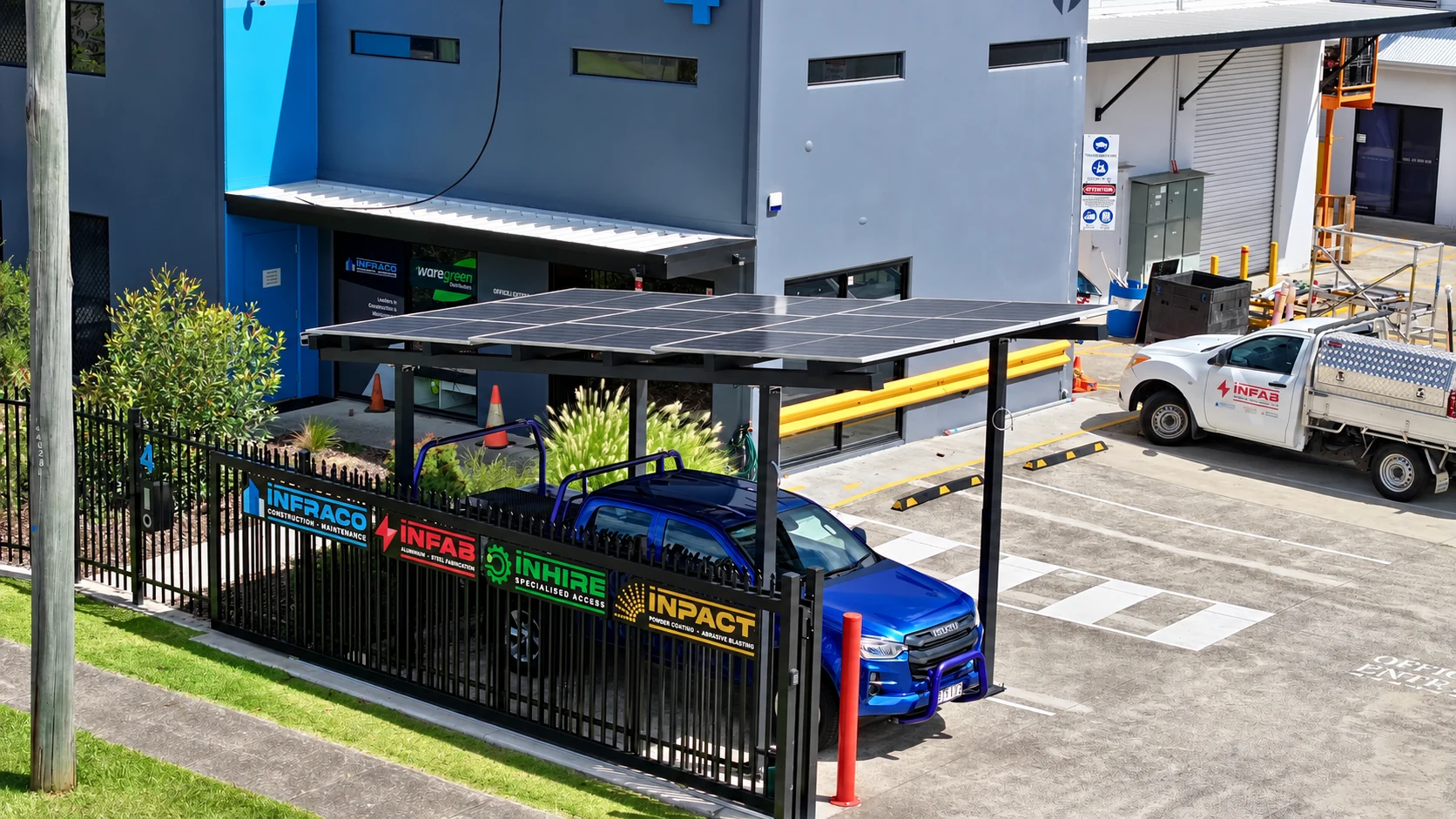 The solar carport beside the existing building and site entrance.