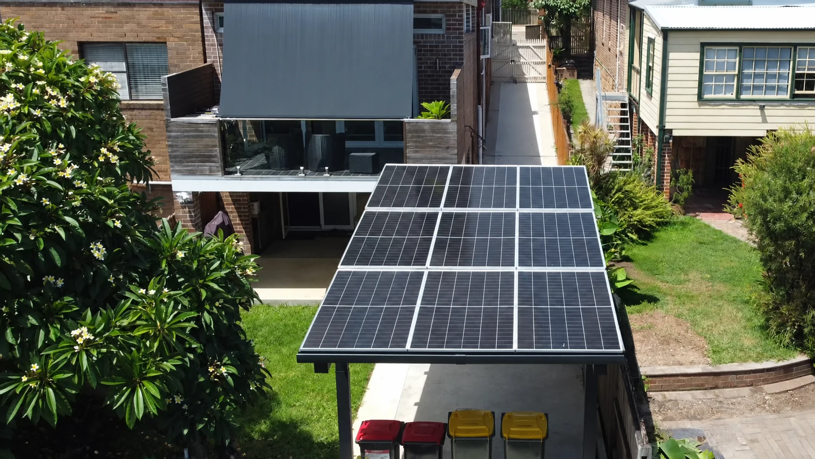 An elevated view of the solar roof beside the existing home.