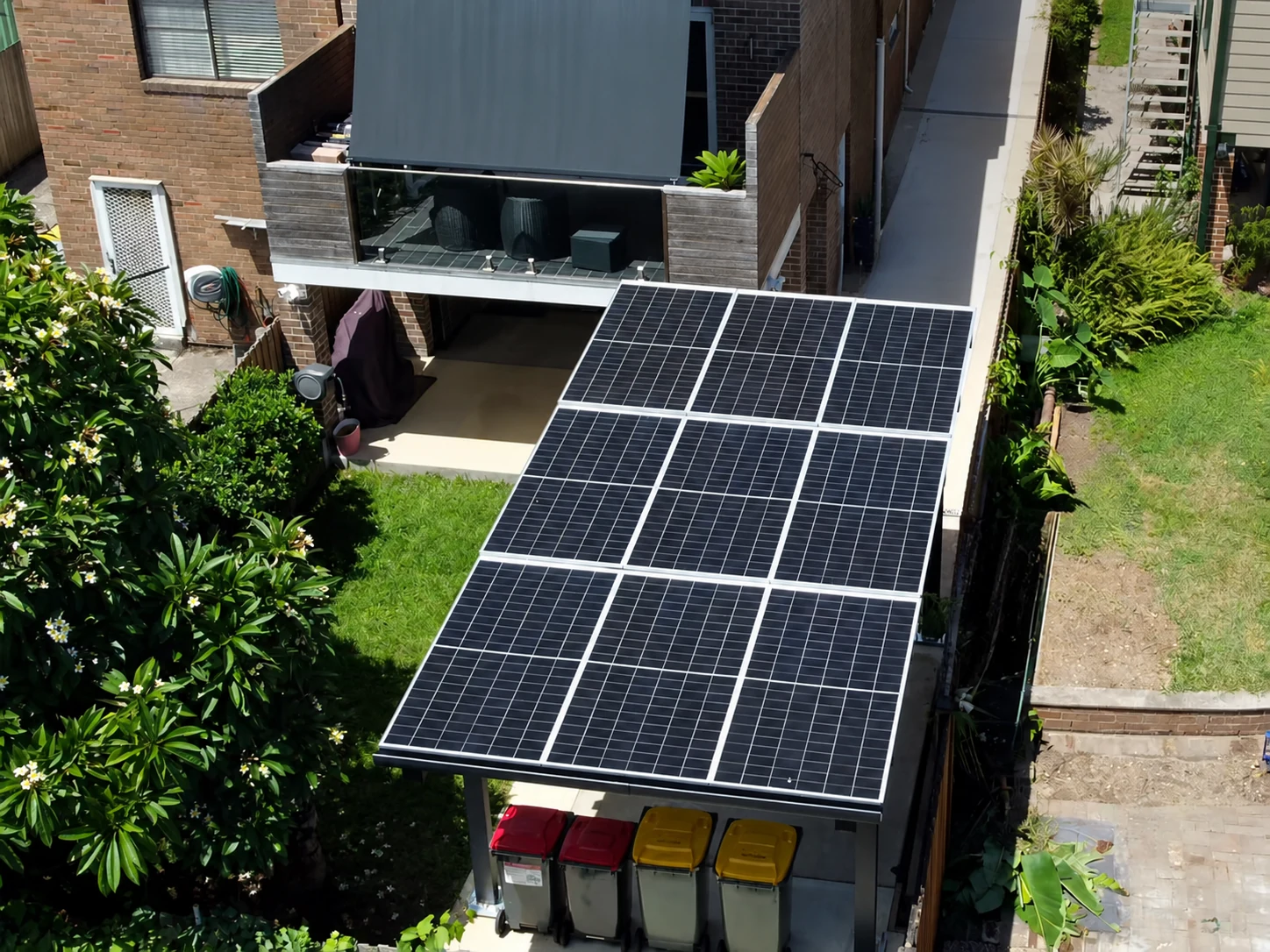 The single carport within the narrow residential driveway.