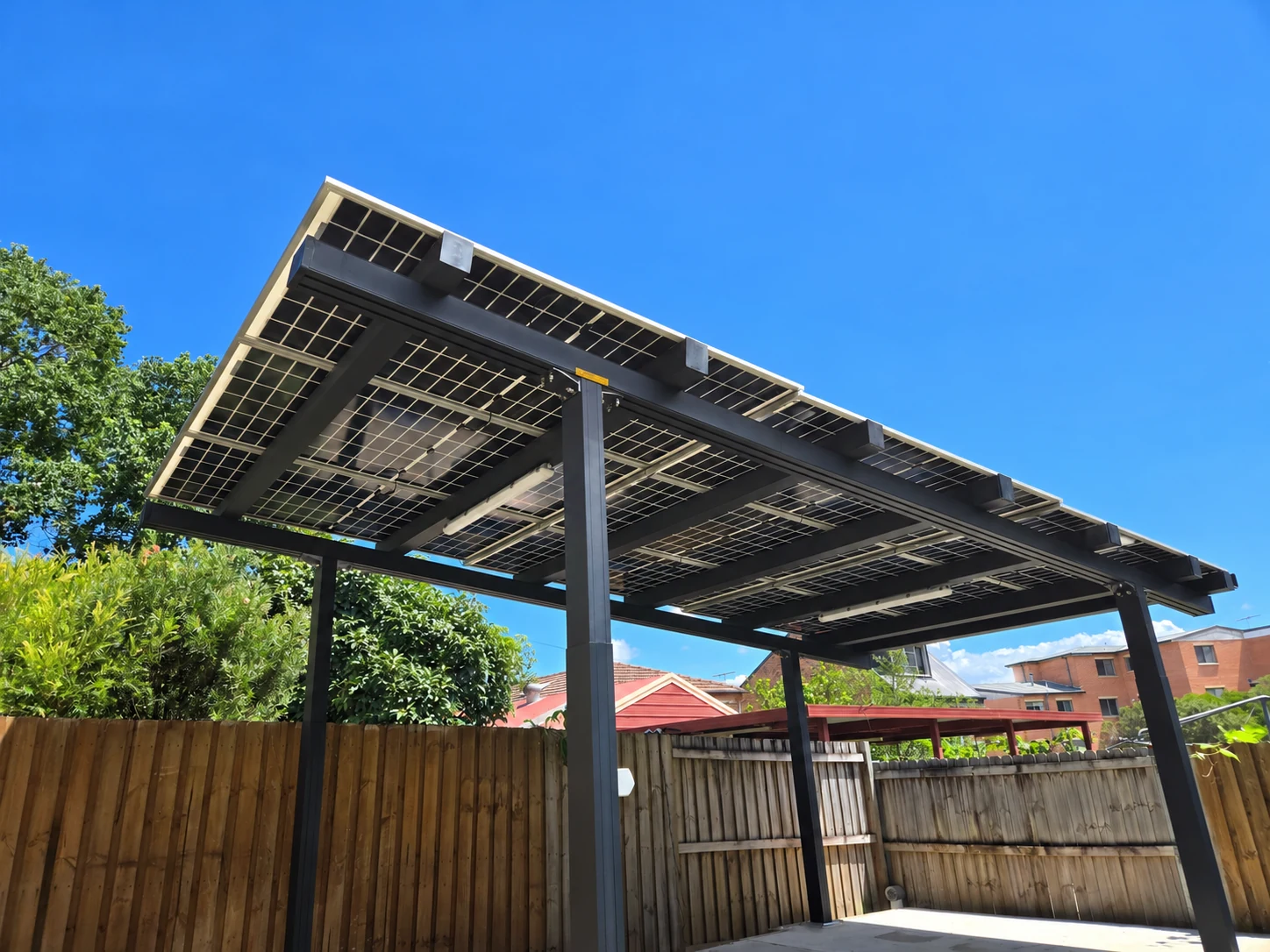 The panel underside and supporting frame against the sky.