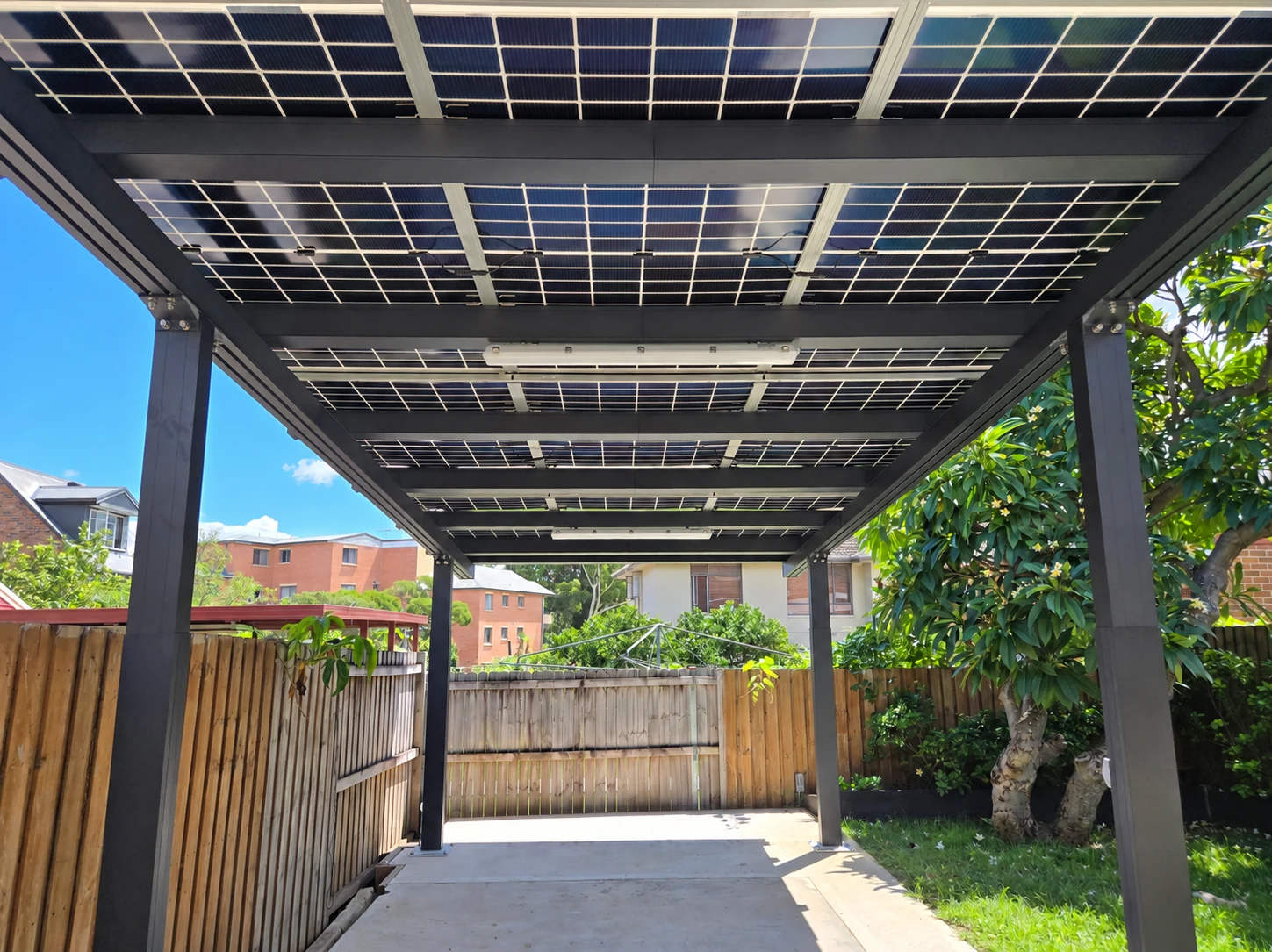 A view along the covered space, showing the panel underside and lights.